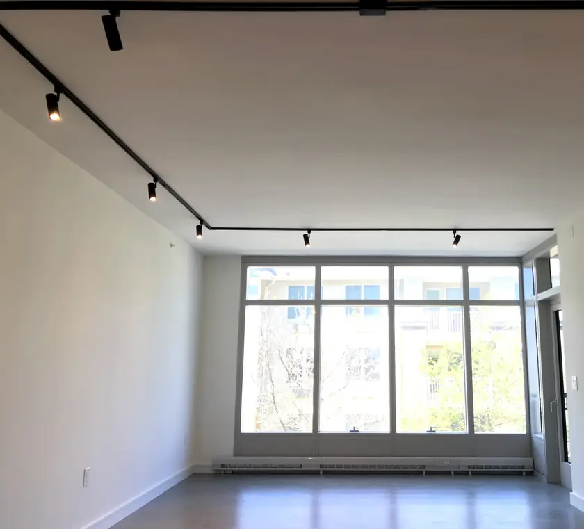 Track lighting installation in a bright open room